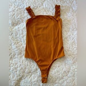 Ribbed Ruffled Mustard Bodysuit